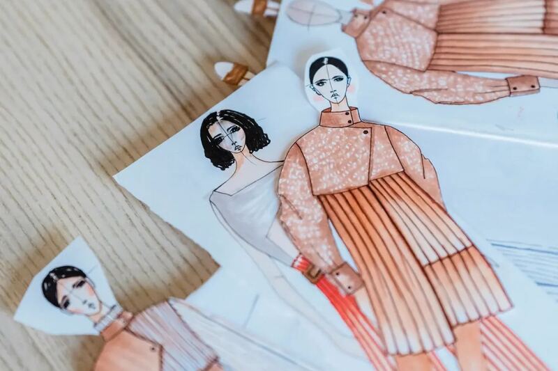 Garment construction in progress at a work bench