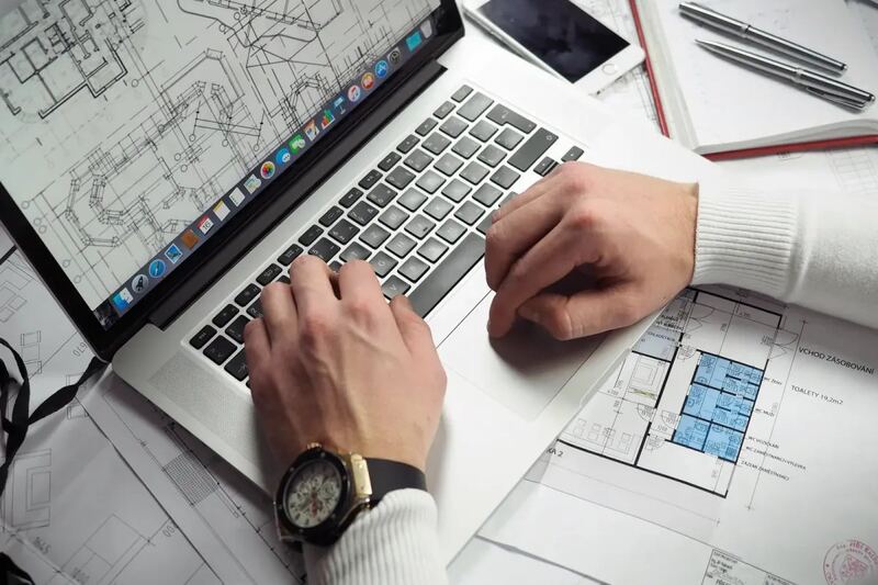 Interior plans and material samples on a work table