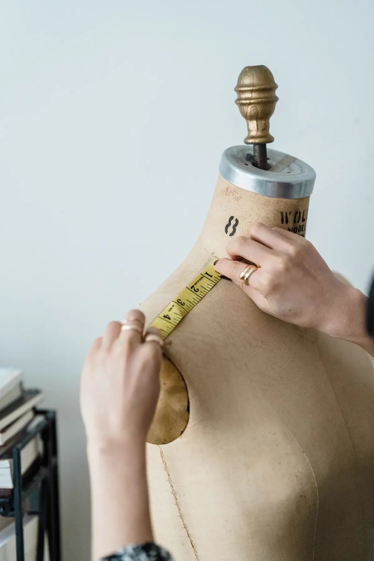 Fashion sketches and design tools on a desk
